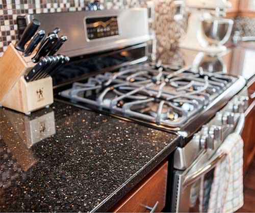 Black galaxy granite with golden sparkles on kitchen countertop